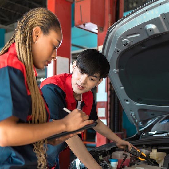 Two young auto technicians