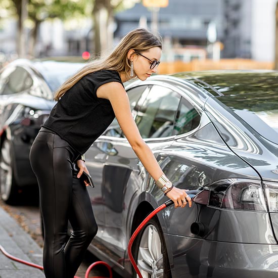 woman fueling car