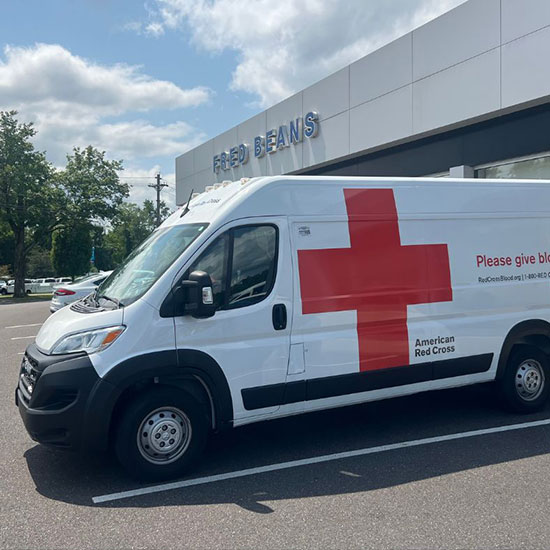the American Red Cross Blood Drive Van outside the Fred Beans Dealership